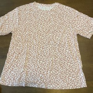 Stars above pink leopard top in size Medium